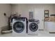 Bright laundry room with washer and dryer included at 328 Dubs Dr, Holly Hill, FL 32117