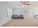 Spacious living room featuring a comfy couch and ceiling fan at 328 Dubs Dr, Holly Hill, FL 32117