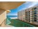 Balcony view of ocean, beach, and neighboring building at 4565 S Atlantic Ave # 5411, Ponce Inlet, FL 32127