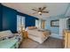 Cozy bedroom with a queen-size bed and wood floors at 4565 S Atlantic Ave # 5411, Ponce Inlet, FL 32127