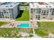 Beachfront community pool with lounge chairs and patio area at 4565 S Atlantic Ave # 5411, Ponce Inlet, FL 32127