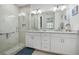 Bathroom with double vanity, granite countertop and walk-in shower at 508 High Tide Ln, Daytona Beach, FL 32124