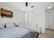 Bedroom with striped bedding and coastal-themed artwork at 508 High Tide Ln, Daytona Beach, FL 32124