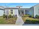 Charming coastal-style home with a welcoming front porch and landscaped yard at 508 High Tide Ln, Daytona Beach, FL 32124