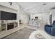 Modern kitchen with white cabinets, island, and breakfast bar at 508 High Tide Ln, Daytona Beach, FL 32124