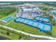 Aerial view of community tennis courts near clubhouse at 508 High Tide Ln, Daytona Beach, FL 32124