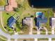 Aerial view of neighborhood homes near lake at 840 Chickadee Dr, Port Orange, FL 32127