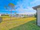 Spacious backyard with lake view, fenced, and grassy area at 840 Chickadee Dr, Port Orange, FL 32127