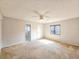 Bright bedroom with ceiling fan and carpeting at 840 Chickadee Dr, Port Orange, FL 32127