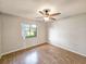 Bedroom with wood-look flooring and ceiling fan at 840 Chickadee Dr, Port Orange, FL 32127