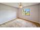 Bedroom featuring a window with backyard view and ceiling fan at 840 Chickadee Dr, Port Orange, FL 32127