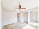 Bedroom with mirrored closet doors and ceiling fan at 840 Chickadee Dr, Port Orange, FL 32127