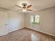 Bedroom with wood-look flooring and a window view at 840 Chickadee Dr, Port Orange, FL 32127