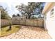 Landscaped backyard with a stone patio at 105 Park Cir, Daytona Beach, FL 32117