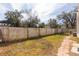 Backyard with wooden fence and stone path at 105 Park Cir, Daytona Beach, FL 32117