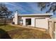 Backyard with access to garage and laundry at 105 Park Cir, Daytona Beach, FL 32117