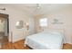 Bedroom with double bed, hardwood floors, and ceiling fan at 105 Park Cir, Daytona Beach, FL 32117