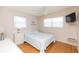 Guest bedroom with wood floors and a ceiling fan at 105 Park Cir, Daytona Beach, FL 32117