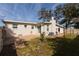 Rear view of the house showcasing a patio and yard at 105 Park Cir, Daytona Beach, FL 32117