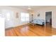 Bright living room with hardwood floors and access to other rooms at 105 Park Cir, Daytona Beach, FL 32117