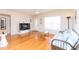 Living room with hardwood floors, and a comfy daybed at 105 Park Cir, Daytona Beach, FL 32117