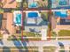 Aerial view of house with pool and surrounding homes at 21 Tipperary Ln, Ormond Beach, FL 32176