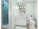 Clean bathroom with a white vanity, tiled shower, and updated fixtures at 21 Tipperary Ln, Ormond Beach, FL 32176