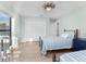 Bedroom with twin beds, large window, and neutral decor, featuring built-in closet at 21 Tipperary Ln, Ormond Beach, FL 32176