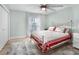 Guest bedroom with metal bed frame and ceiling fan at 21 Tipperary Ln, Ormond Beach, FL 32176