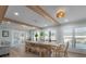 Bright dining room featuring a long wooden table and bench at 21 Tipperary Ln, Ormond Beach, FL 32176