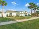 Light green house with white trim and a spacious lawn at 21 Tipperary Ln, Ormond Beach, FL 32176