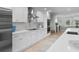 Spacious kitchen with white cabinets, stainless steel appliances, and quartz countertops at 21 Tipperary Ln, Ormond Beach, FL 32176