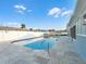 Inviting swimming pool with large patio and surrounding landscaping at 21 Tipperary Ln, Ormond Beach, FL 32176