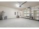 Spacious garage with epoxy flooring and built-in shelving for optimal storage at 2869 Monaghan Dr, Ormond Beach, FL 32174