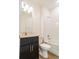 Bathroom features granite countertop, dark wood cabinet, tiled shower, and vinyl flooring at 3142 Silvermines Ave, Ormond Beach, FL 32174