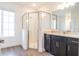 Bathroom showcases tile floors, a shower with glass doors, granite countertops, and sleek dark cabinetry at 3142 Silvermines Ave, Ormond Beach, FL 32174