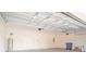 Spacious garage with overhead door, utility sink, and ample room for storage or projects at 3142 Silvermines Ave, Ormond Beach, FL 32174
