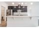 Open floor plan featuring kitchen with stainless steel appliances, granite counters, and island with sink at 3142 Silvermines Ave, Ormond Beach, FL 32174