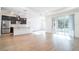 Open floor plan featuring kitchen with stainless steel appliances and large sliding glass doors at 3142 Silvermines Ave, Ormond Beach, FL 32174