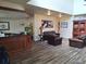 Inviting lobby with wood flooring, comfortable seating, and warm decor creating a welcoming atmosphere at 3142 Silvermines Ave, Ormond Beach, FL 32174