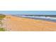 Expansive beach with sandy shoreline and ocean waves at 3370 Ocean Shore Blvd # 3060, Ormond Beach, FL 32176