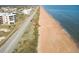 Aerial view of beach, road, and oceanfront building at 3370 Ocean Shore Blvd # 3060, Ormond Beach, FL 32176