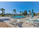 Community pool with lounge chairs and tables at 3370 Ocean Shore Blvd # 3060, Ormond Beach, FL 32176