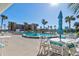 Community pool with surrounding patio furniture at 3370 Ocean Shore Blvd # 3060, Ormond Beach, FL 32176