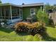 Screened patio, grill, and lush landscaping in backyard at 41 Laurel Oaks Cir, Ormond Beach, FL 32174