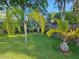 Relaxing backyard with tropical plants and grassy area at 41 Laurel Oaks Cir, Ormond Beach, FL 32174