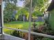 Lush backyard with fountain, palm trees, and tropical plants at 41 Laurel Oaks Cir, Ormond Beach, FL 32174