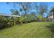 Expansive backyard with well-maintained lawn and tropical plants at 41 Laurel Oaks Cir, Ormond Beach, FL 32174