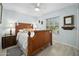 Second bedroom with wood bed frame and light decor at 41 Laurel Oaks Cir, Ormond Beach, FL 32174