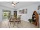 Bright dining room with glass-top table and four chairs at 41 Laurel Oaks Cir, Ormond Beach, FL 32174